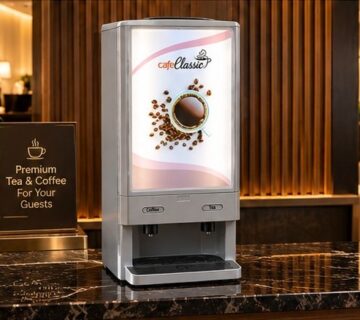 Cafe Classic vending machine serving tea and coffee to guests in a hotel lobby